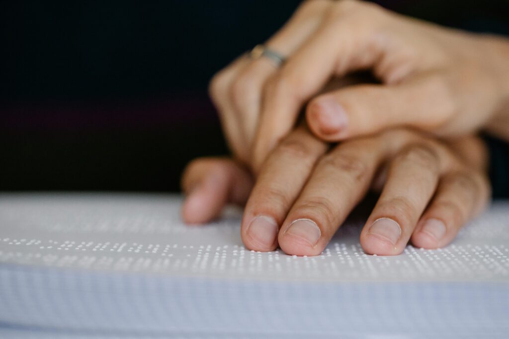Two people's hands touching, representing the physical and neurological reality of human attachment.
