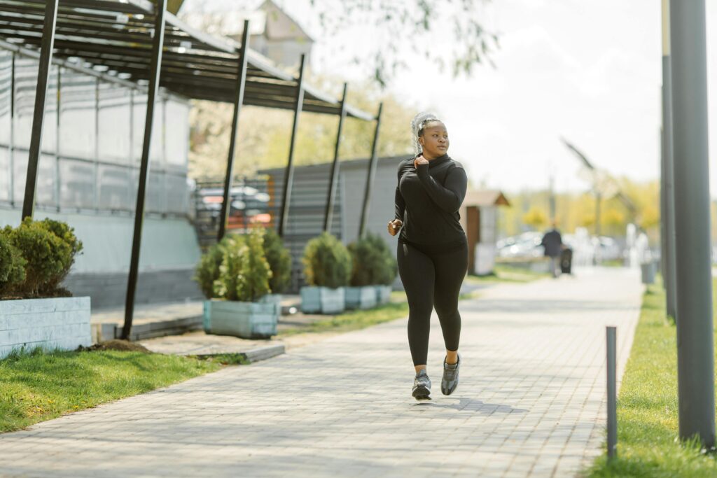 Person walking outdoors, using movement to support nervous system health.