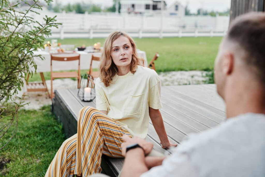 Two people in calm, open conversation, representing healthy boundary-setting in relationships.