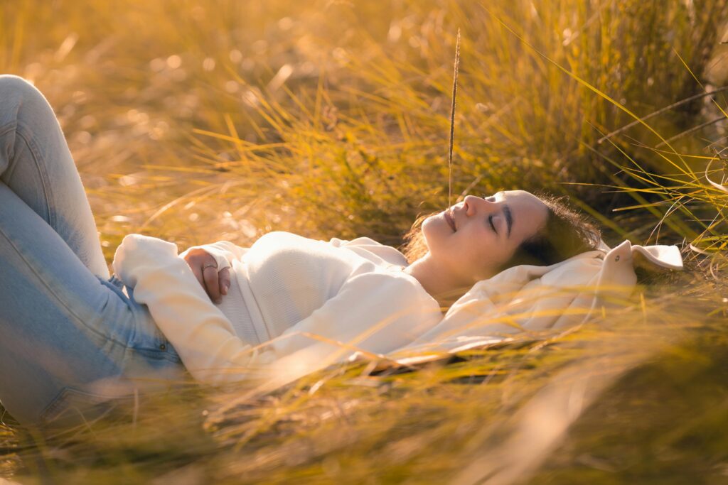 Highly sensitive person sitting alone in a quiet space, regulating their nervous system.