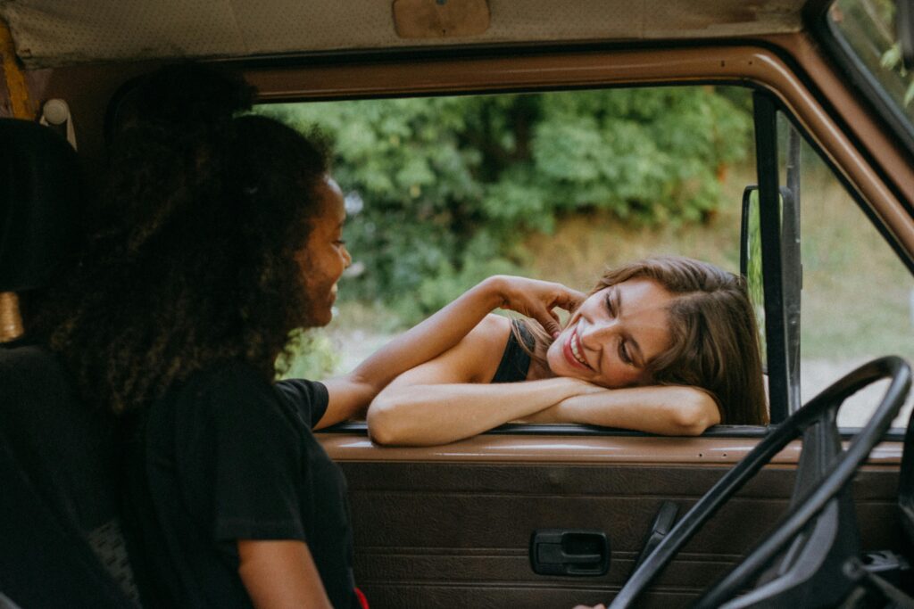 Two people in easy, warm connection, representing the felt safety of secure attachment.