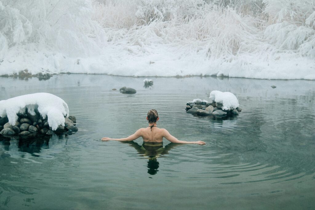 Person experiencing cold water exposure, using it for nervous system regulation.
