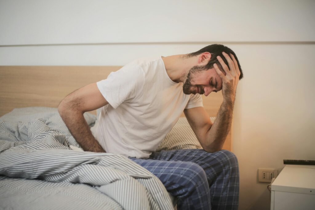 Person experiencing chronic pain, representing the nervous system connection to persistent pain.