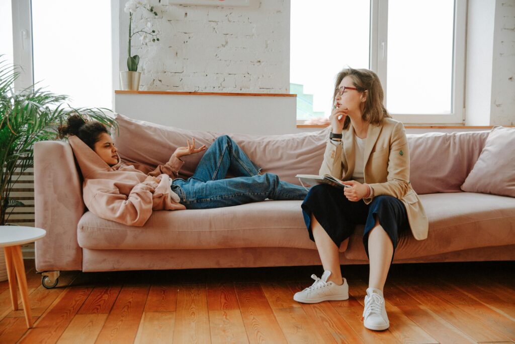 Person in a somatic therapy session, experiencing body-based healing in a safe therapeutic relationship.